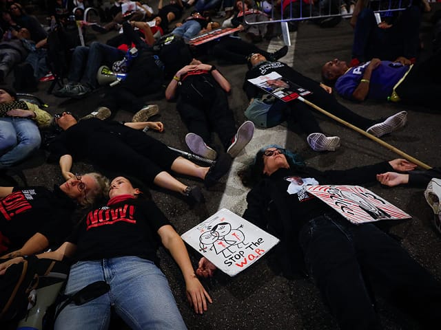 Protesters block traffic on Menachem Begin street in Tel Aviv