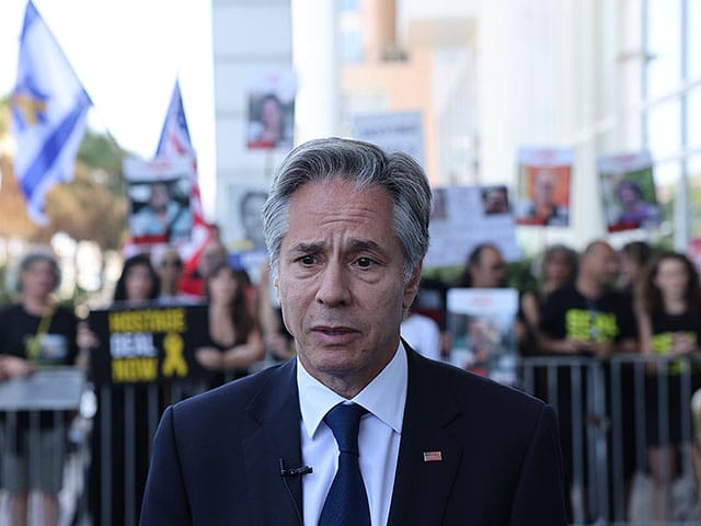 Protesters gather outside Tel Aviv hotel amid Herzog-Blinken meeting