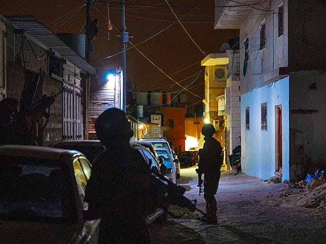 IDF detains 14 suspects in Judea and Samaria, soldier injured during special operations